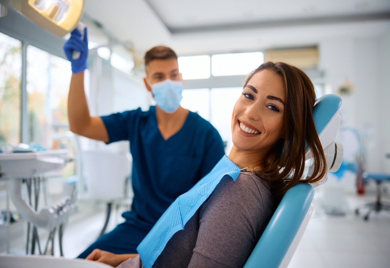 Smiling patient after bad breath care in Livonia, MI