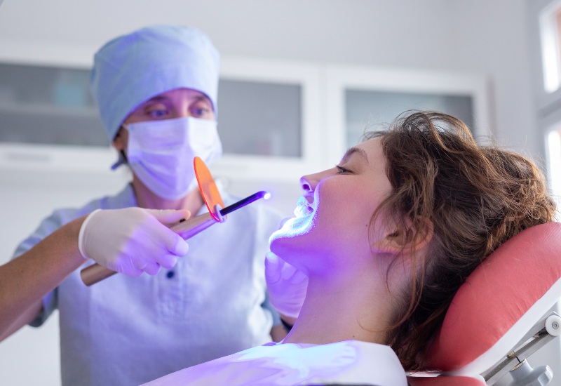 Curing light used in cosmetic dental treatment in Arlington Heights, IL